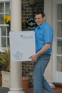 Man carrying box carefully