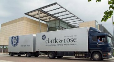 Large lorry outside large modern office