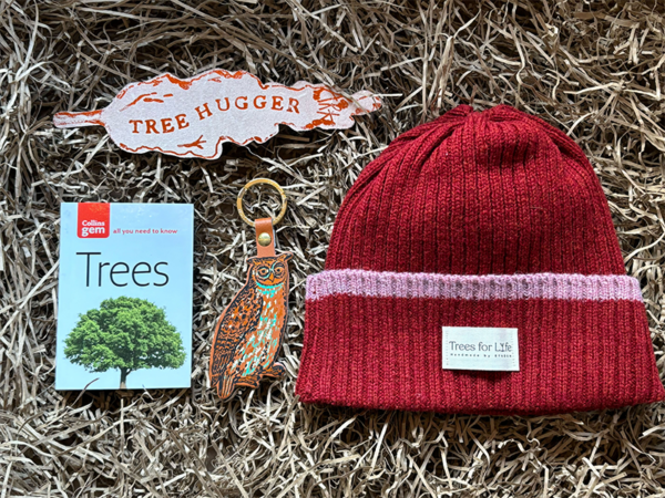 Nature lover gift set, showing lambs wool hat, tree ID book, tree hugger leather book mark and owl keyring