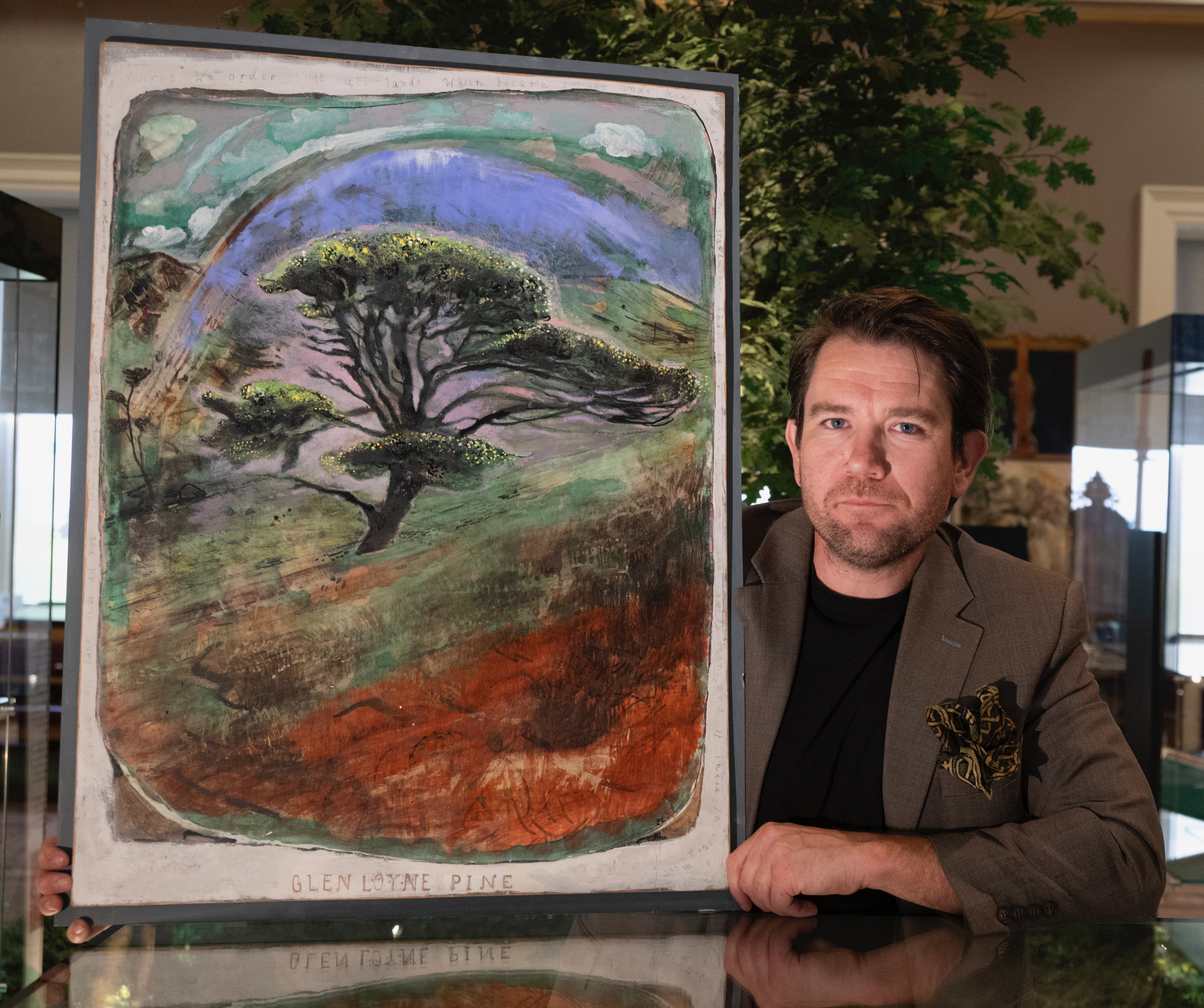 Dan Llywelyn Hall outside the Society of Antiquaries with one of his works inspired by the Charter of the Forest on view during the Magna Carta 1225 exhibition, Glen Loyne Pine.